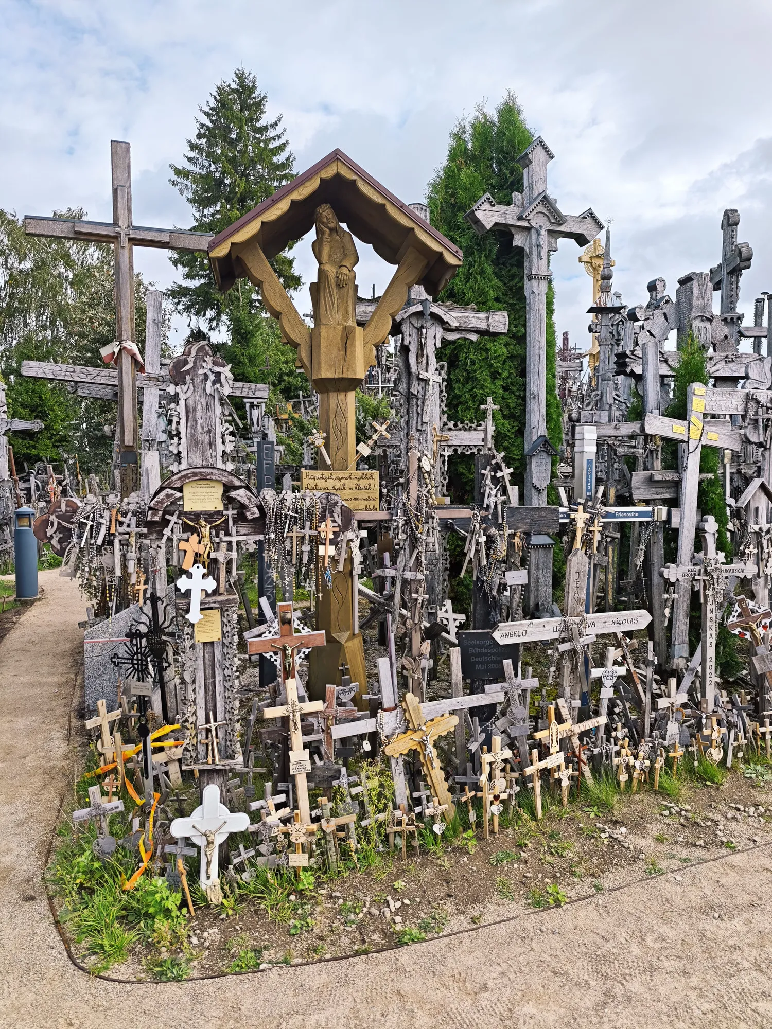 The Hill of Crosses near Šiauliai: wooden crosses, crucifixes and rosaries packed so tightly they form a single mass.