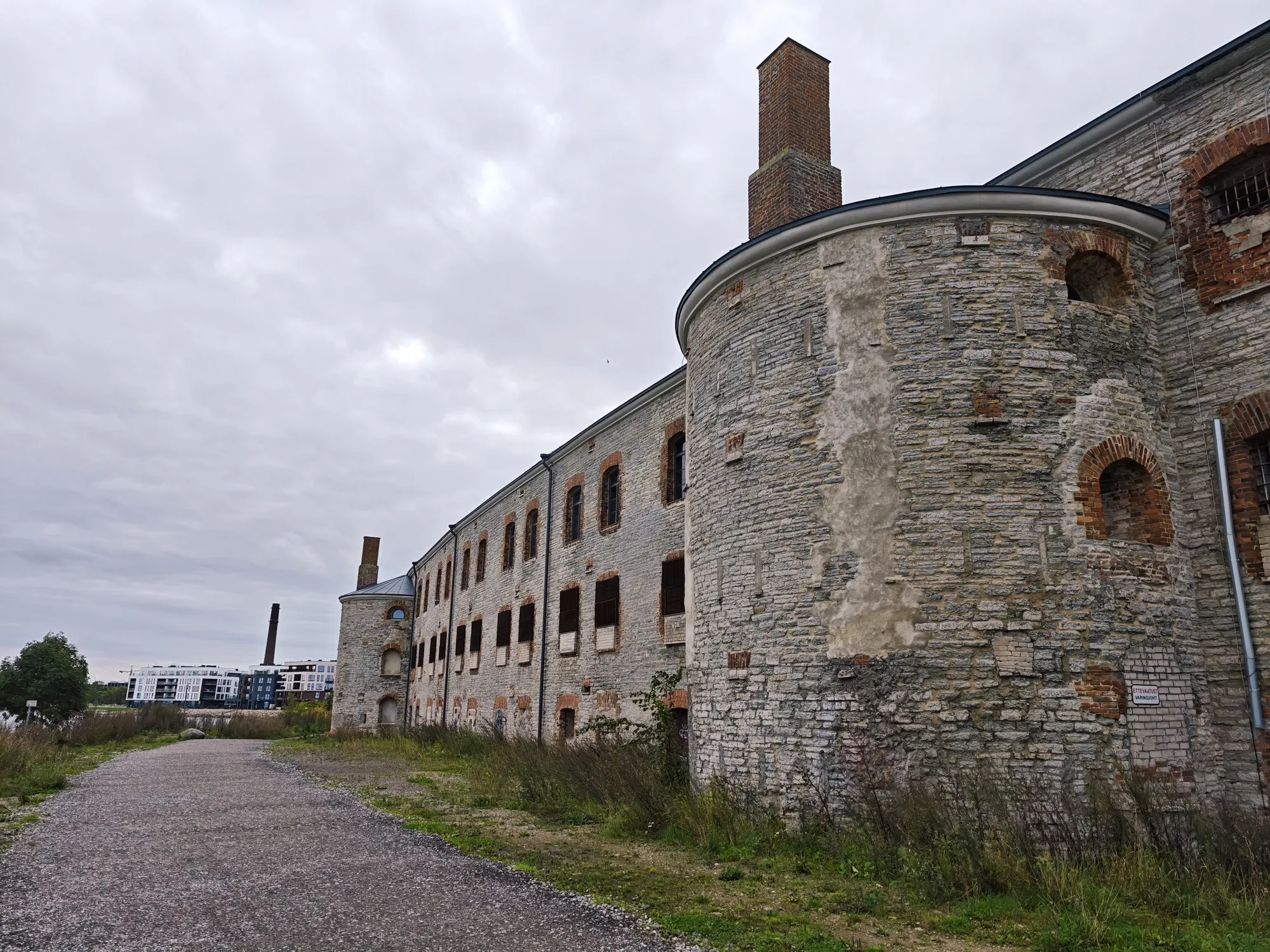 The walls of Patarei, a sea fortress turned prison on Tallinn's waterfront, under a grey sky.